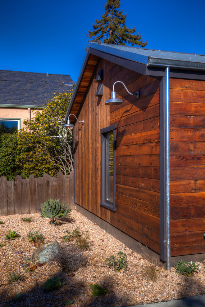 Photo of a mid-sized country one-storey brown exterior in San Francisco with wood siding.