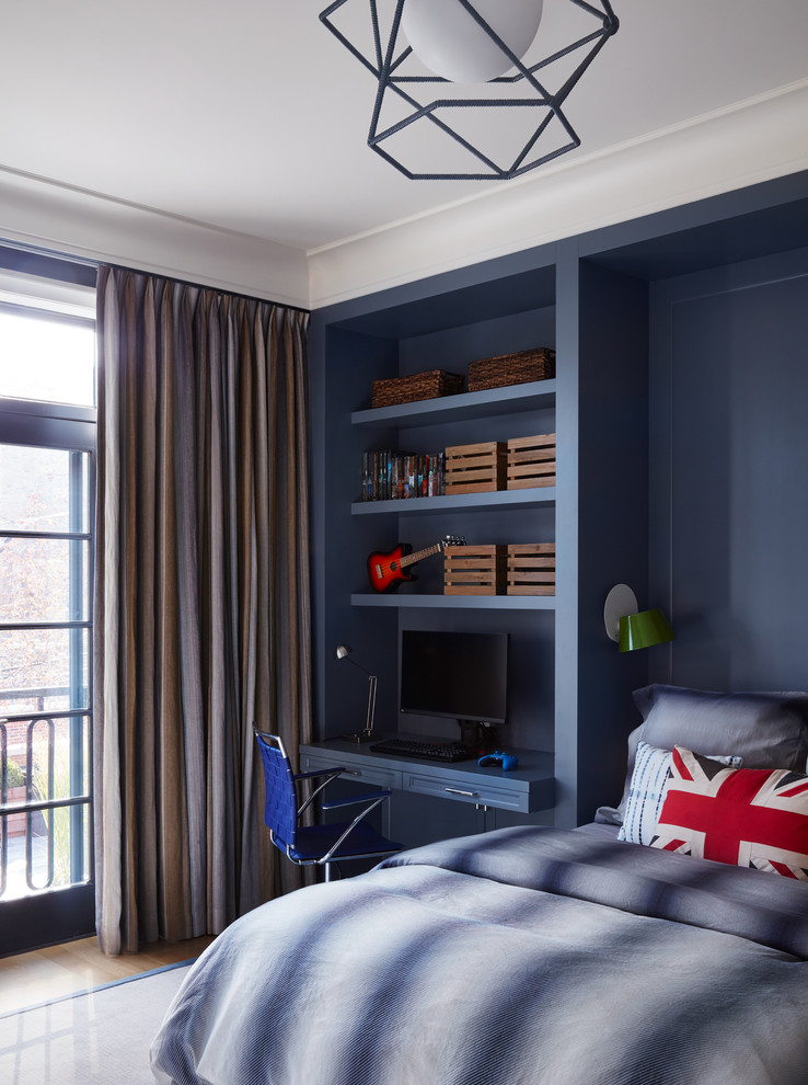 This is an example of a transitional kids' bedroom in Chicago with blue walls, light hardwood floors and beige floor.