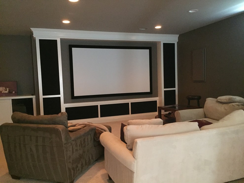 Design ideas for a mid-sized traditional open concept home theatre in DC Metro with grey walls, carpet, a projector screen and beige floor.