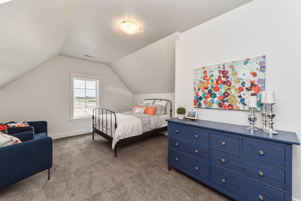 This is an example of a country guest bedroom in Boise with white walls and carpet.