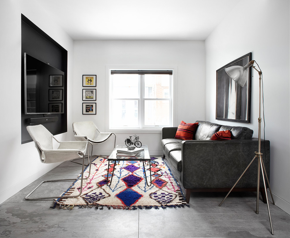 Inspiration for an industrial living room in Toronto with white walls and a wall-mounted tv.