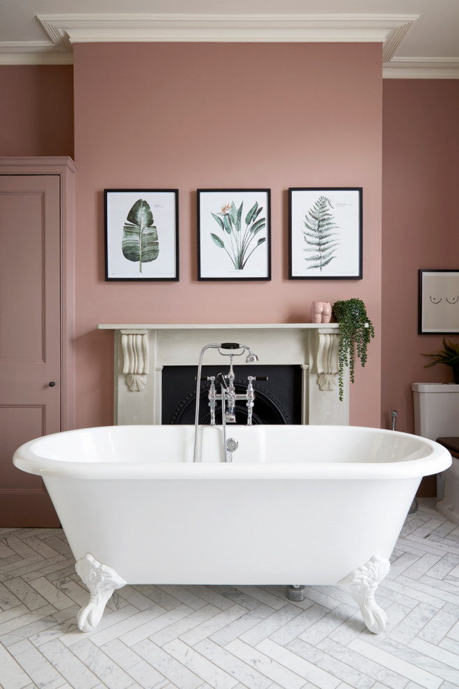 This is an example of a large contemporary ensuite bathroom in London with pink walls, marble worktops, double sinks, recessed-panel cabinets, a freestanding bath, a walk-in shower, a two-piece toilet, porcelain flooring, a submerged sink, grey floors, a hinged door, grey worktops, a chimney breast and a freestanding vanity unit.