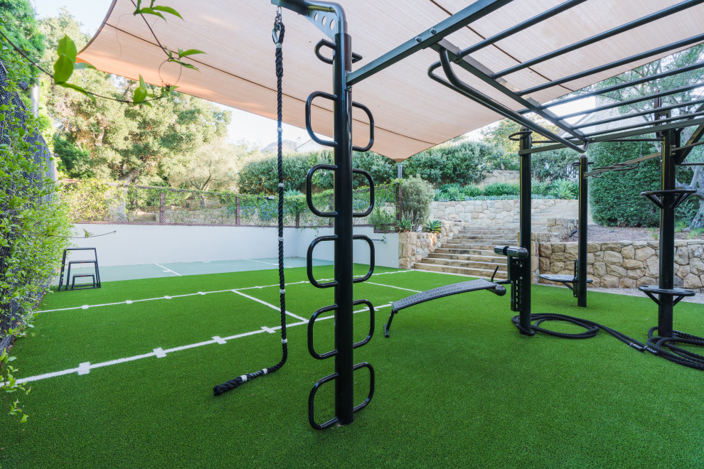 Design ideas for a mid-sized multipurpose gym in Santa Barbara with green floor.