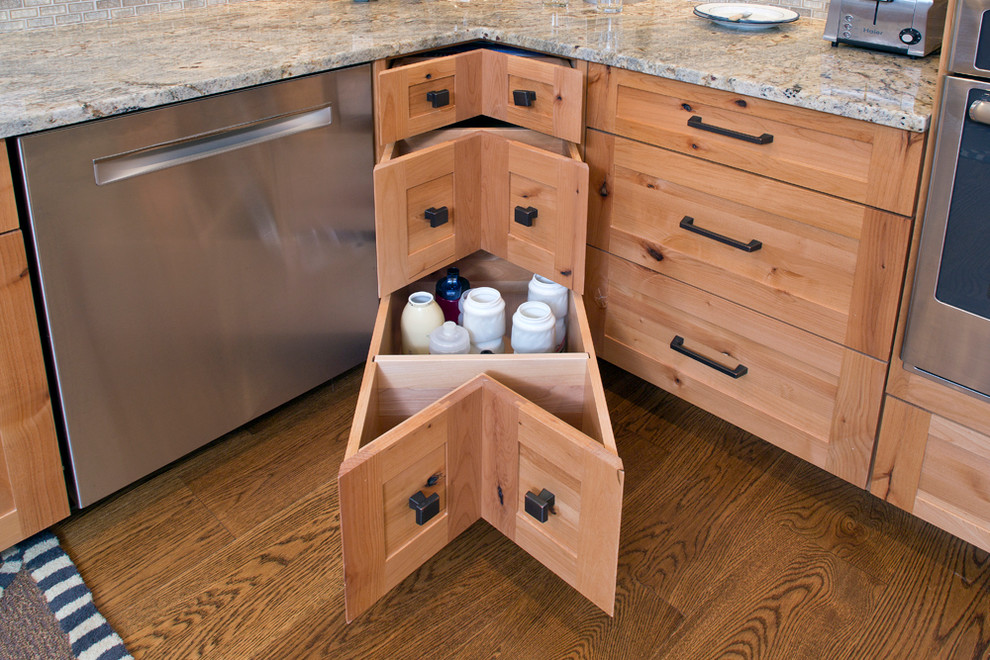 Mid-sized transitional u-shaped medium tone wood floor eat-in kitchen photo with shaker cabinets, stainless steel appliances, a peninsula, an undermount sink, medium tone wood cabinets, granite countertops, beige backsplash and matchstick tile backsplash