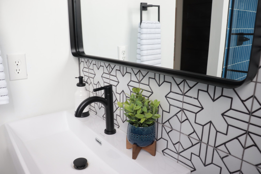 Photo of a small classic ensuite bathroom in Atlanta with white cabinets, a walk-in shower, a two-piece toilet, black and white tiles, terracotta tiles, blue walls, terracotta flooring, solid surface worktops, white floors, a hinged door, a single sink, a floating vanity unit and all types of ceiling.