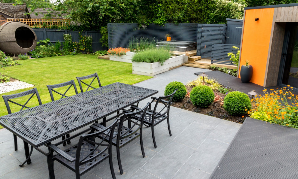 Photo of a mid-sized country backyard patio in West Midlands.