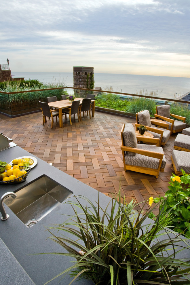 Design ideas for an expansive contemporary rooftop deck in Chicago with an outdoor kitchen and no cover.