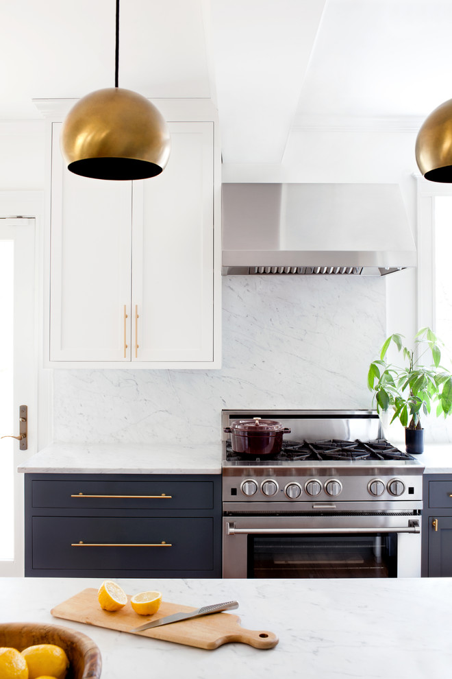 Inspiration for a transitional kitchen in Baltimore with shaker cabinets, marble benchtops, stone slab splashback and stainless steel appliances.