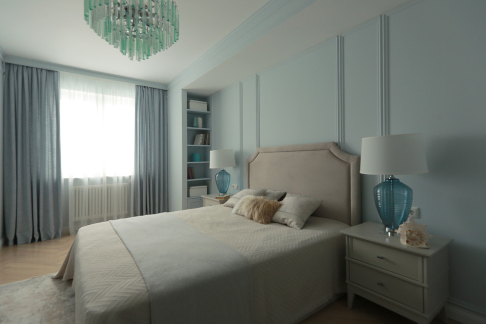 Medium sized traditional master bedroom in Moscow with blue walls, light hardwood flooring and beige floors.