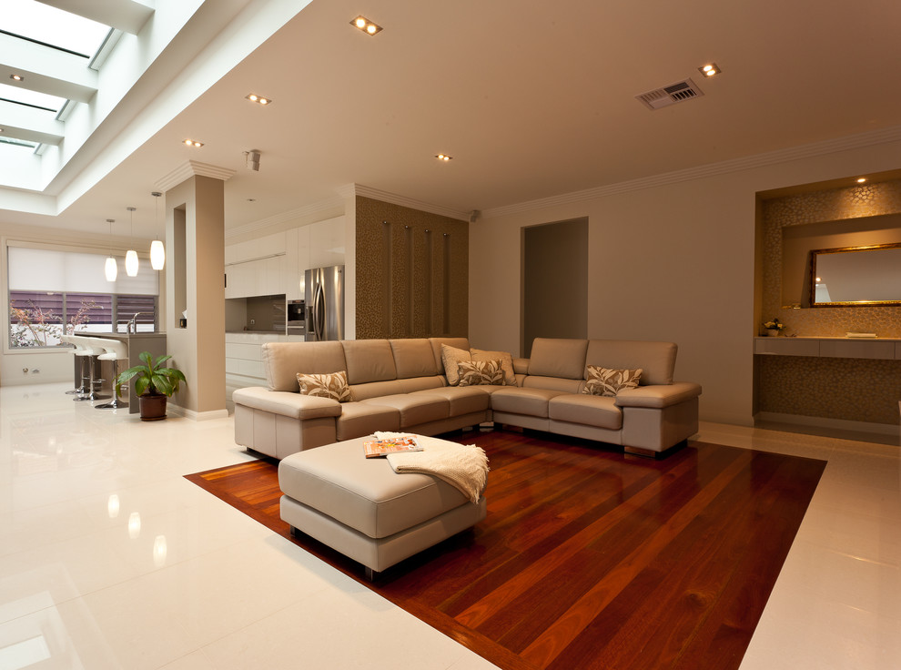 This is an example of a mid-sized contemporary formal open concept living room in Sydney with white walls, medium hardwood floors, a standard fireplace and a tile fireplace surround.