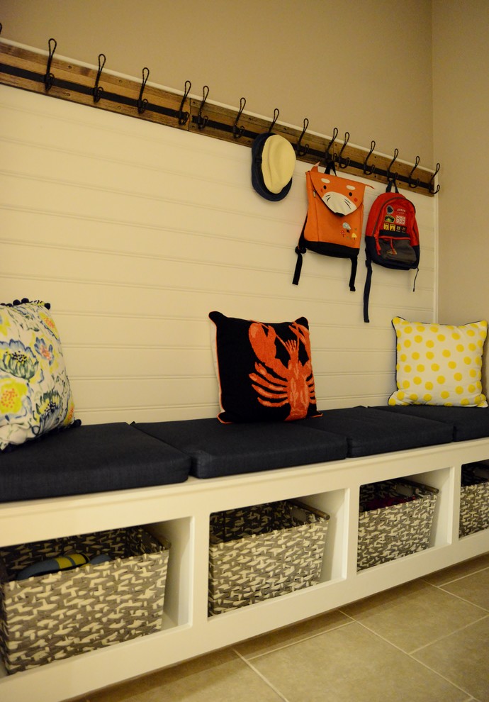 Mudroom - small transitional ceramic tile mudroom idea in Austin with beige walls