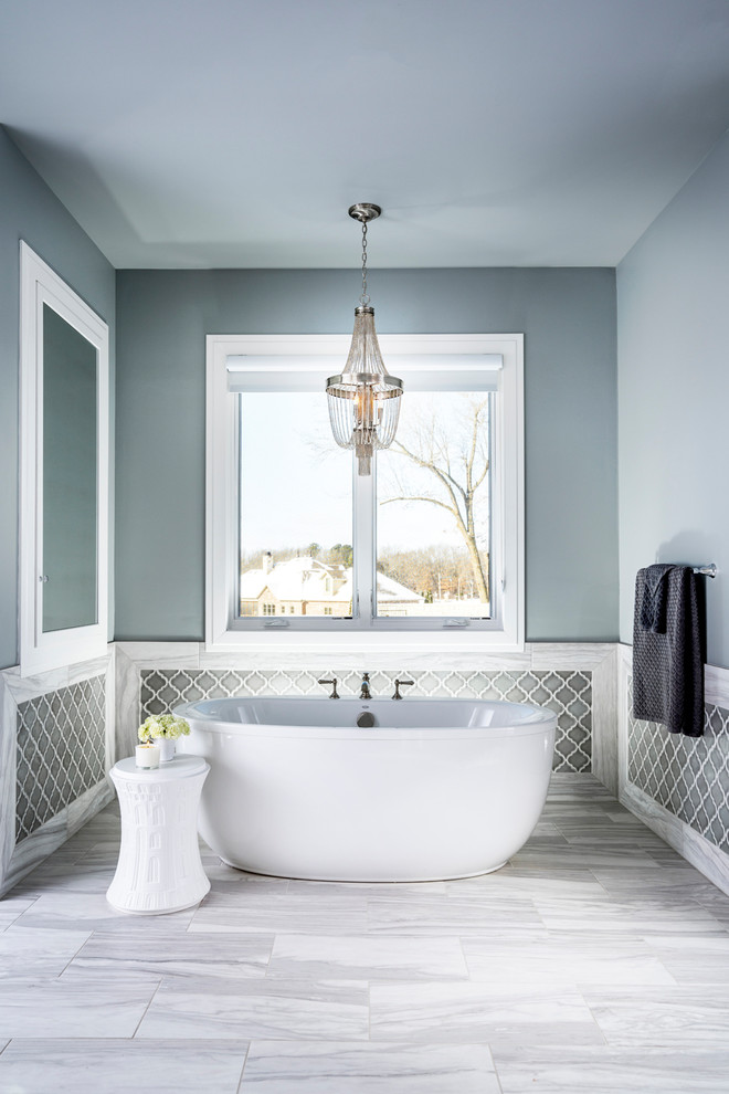 Large transitional master bathroom in Other with grey cabinets, a freestanding tub, an alcove shower, an undermount sink and a hinged shower door.