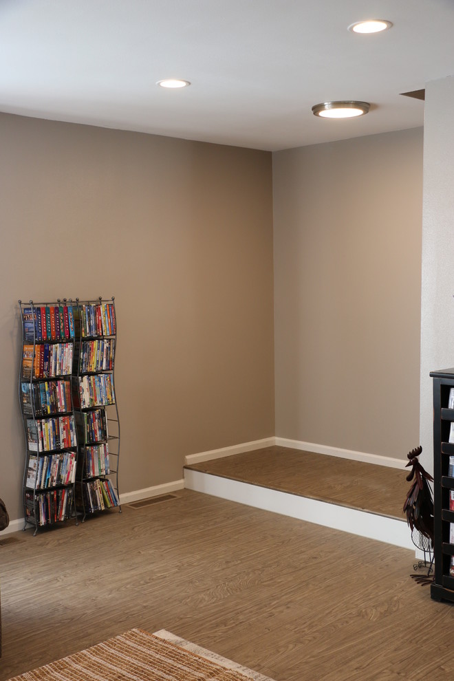 Small transitional u-shaped vinyl floor and brown floor eat-in kitchen photo in Denver with an undermount sink, recessed-panel cabinets, white cabinets, granite countertops, gray backsplash, ceramic backsplash, black appliances, no island and white countertops