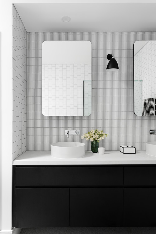 Modern Sophistication: Black Flat-Panels and Mosaic Tile Walls in a Contemporary Setting