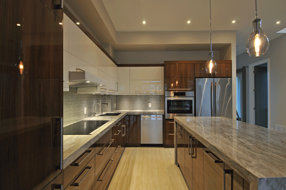 Photo of a mid-sized contemporary l-shaped eat-in kitchen in Toronto with an undermount sink, flat-panel cabinets, white cabinets, limestone benchtops, grey splashback, ceramic splashback, stainless steel appliances, dark hardwood floors, with island, brown floor and brown benchtop.