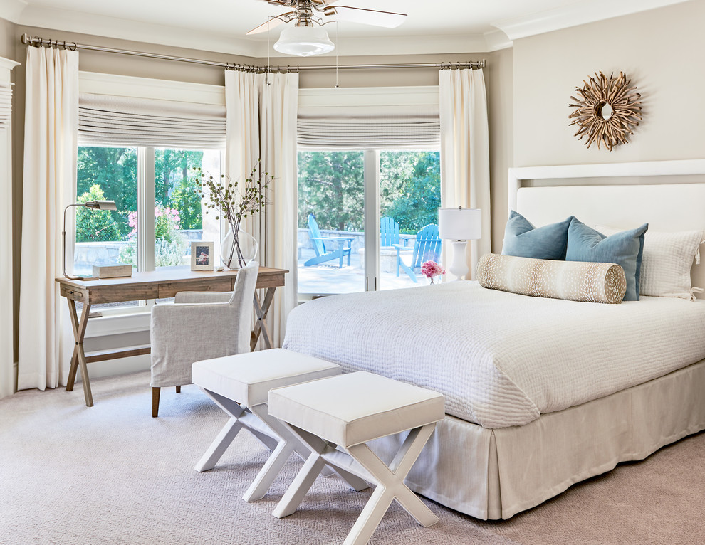 Photo of a beach style master bedroom in Charlotte with beige walls, carpet, no fireplace and grey floor.