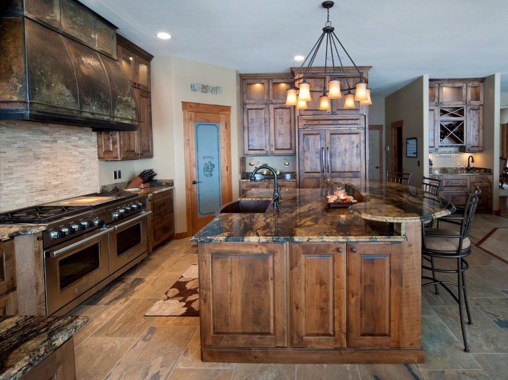 Mountain style kitchen photo with a farmhouse sink, raised-panel cabinets, dark wood cabinets and granite countertops