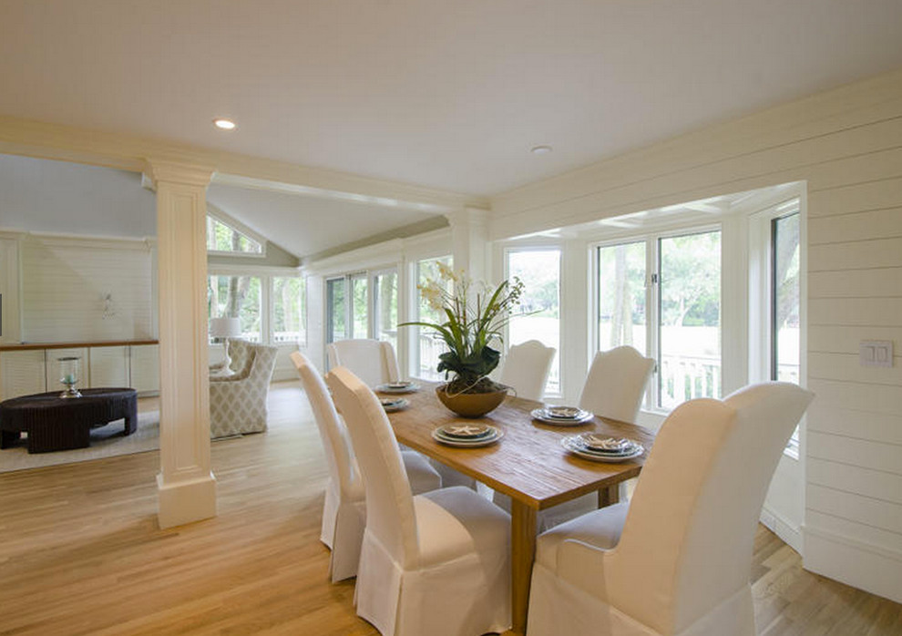 Design ideas for a large beach style kitchen/dining combo in Boston with white walls and light hardwood floors.