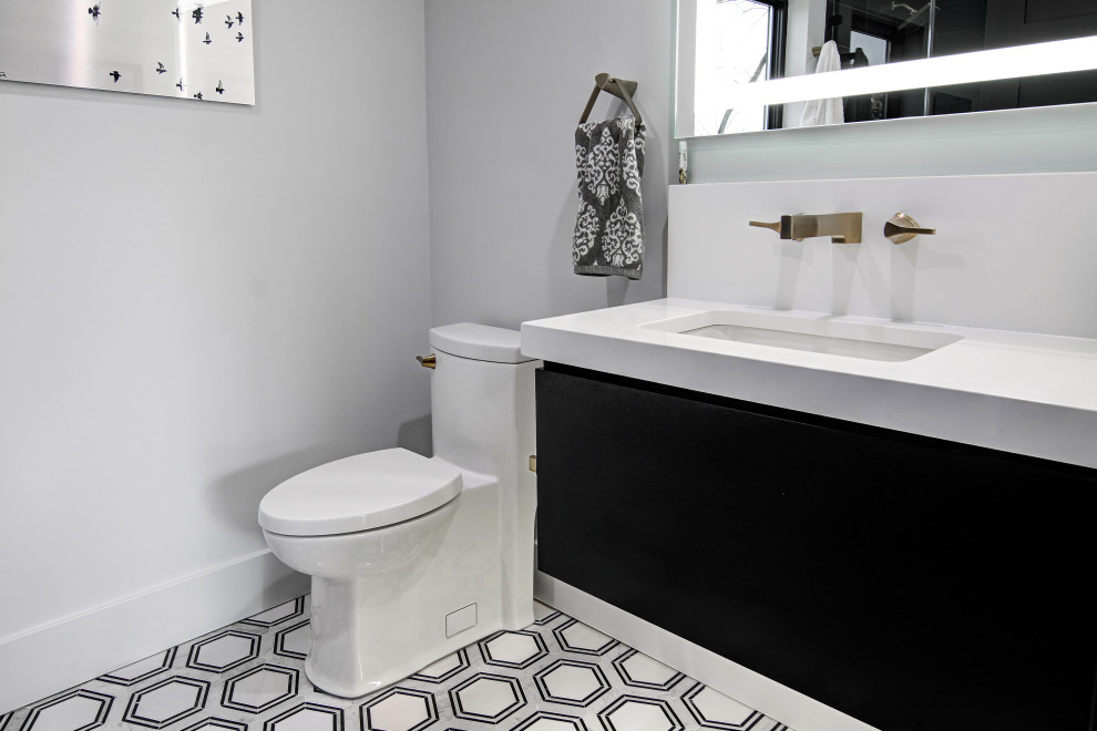 Design ideas for a mid-sized modern 3/4 bathroom in Miami with flat-panel cabinets, black cabinets, an alcove shower, a one-piece toilet, black tile, porcelain tile, white walls, porcelain floors, a drop-in sink, engineered quartz benchtops, multi-coloured floor, a hinged shower door, white benchtops, a single vanity and a floating vanity.