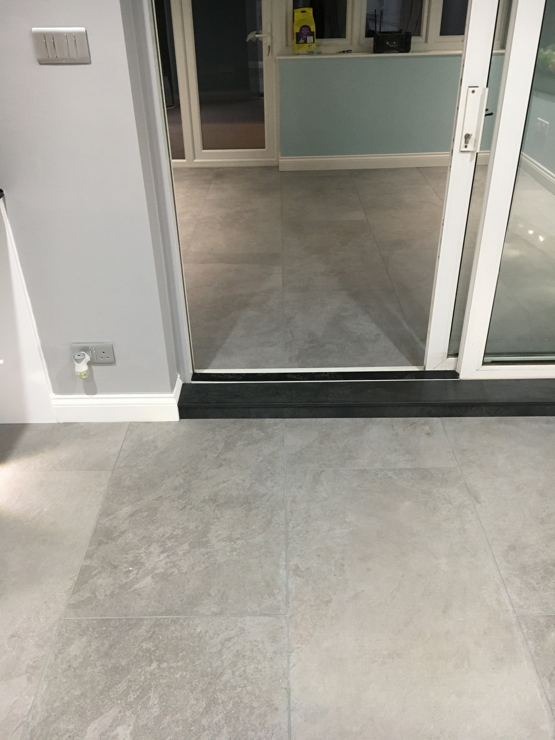 J pull handle Kitchen with compact laminate and porcelain floor tiles
