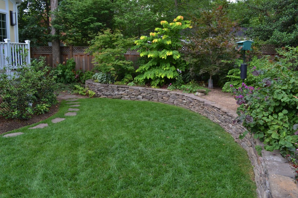 This is an example of a country backyard garden in DC Metro with natural stone pavers.