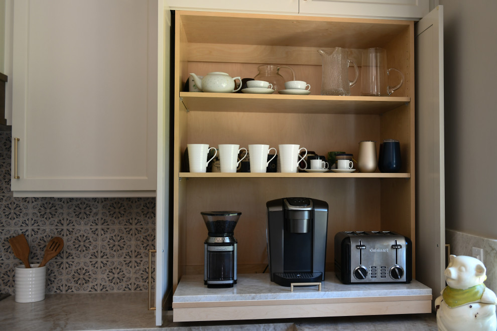Inspiration for a large timeless u-shaped vinyl floor and brown floor open concept kitchen remodel in San Diego with a farmhouse sink, shaker cabinets, beige cabinets, quartzite countertops, blue backsplash, limestone backsplash, paneled appliances, an island and beige countertops