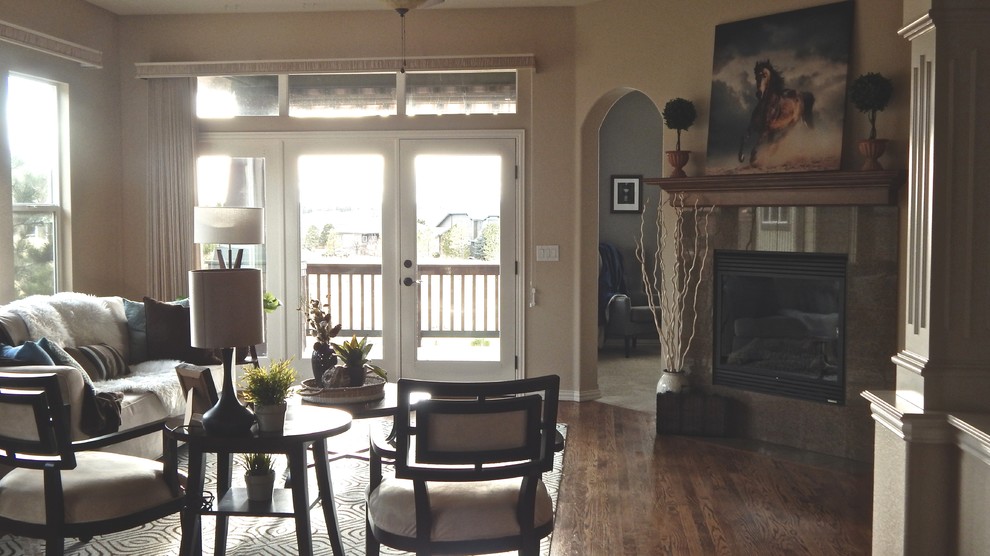 Example of a transitional home design design in Denver