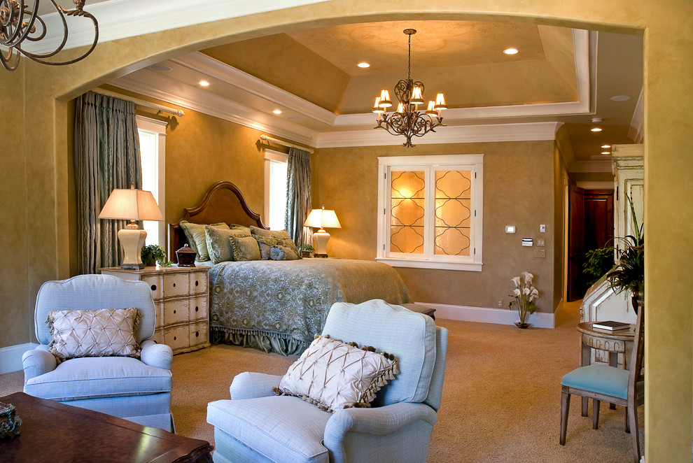 Inspiration for a mid-sized traditional master bedroom in Charlotte with yellow walls, carpet and no fireplace.