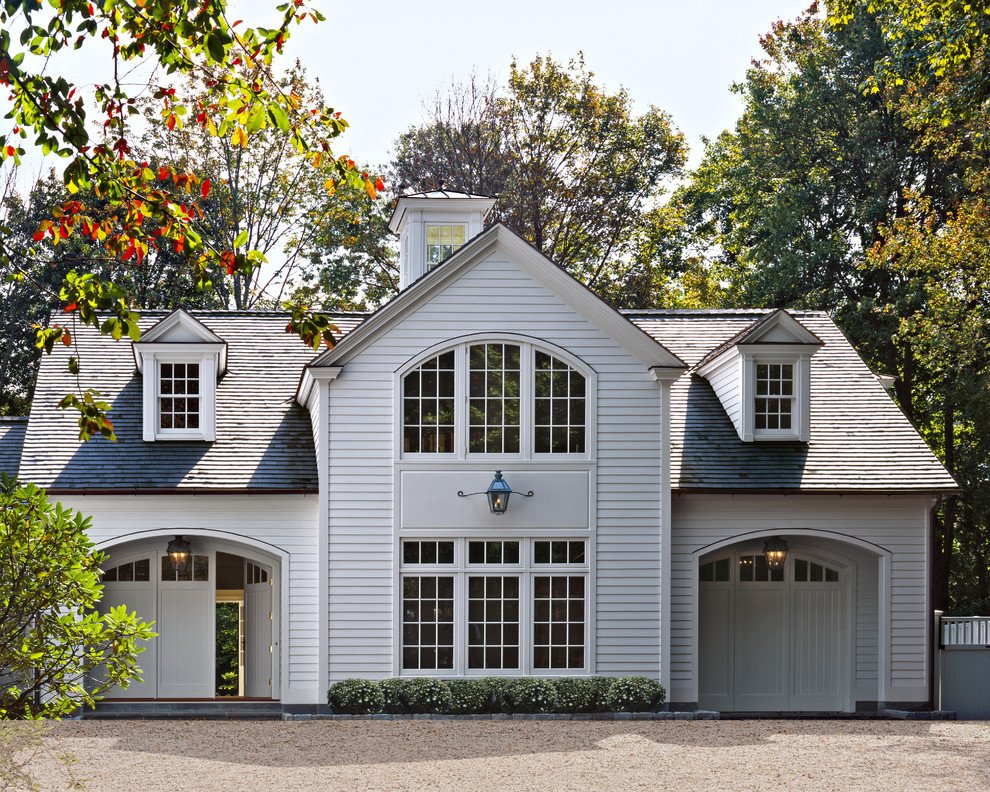 Inspiration for a traditional two-storey white exterior in New York with a hip roof and a shingle roof.
