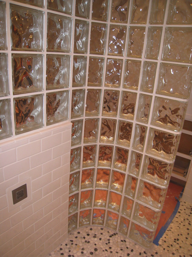 Inspiration for a mid-sized transitional master white tile and subway tile pebble tile floor home design remodel in Seattle with gray walls