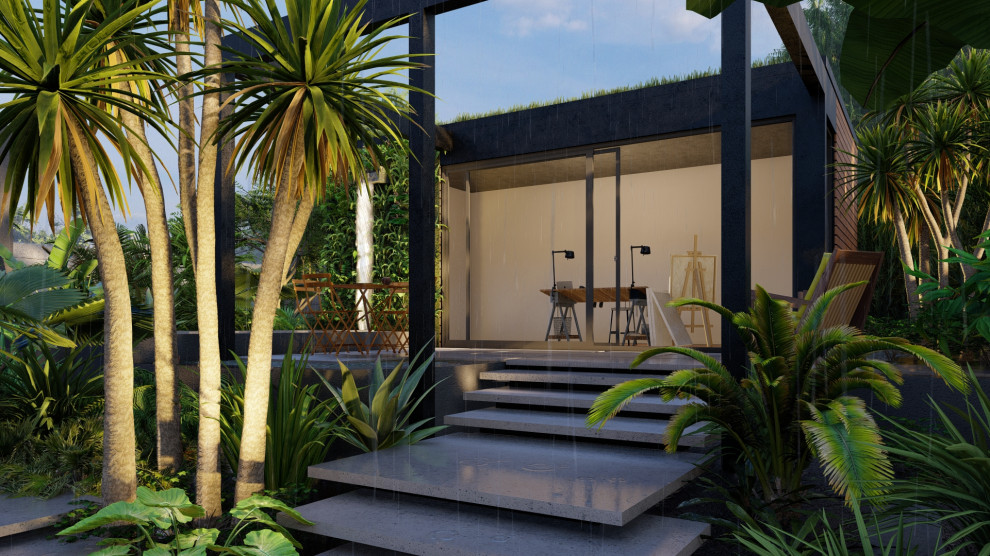 Idee per un grande giardino formale tropicale esposto a mezz'ombra dietro casa in estate con fontane, pavimentazioni in cemento e recinzione in pietra