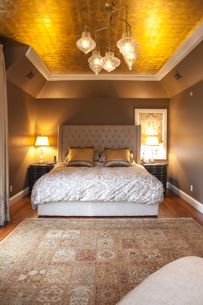 This is an example of a large eclectic master bedroom in New York with beige walls and carpet.