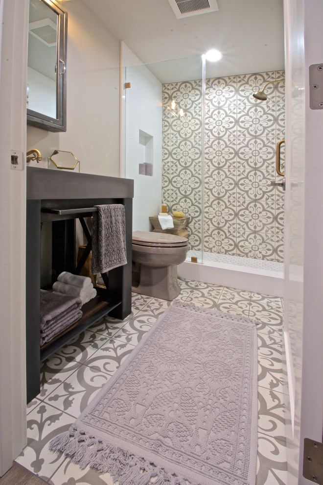 Inspiration for a small eclectic bathroom in San Francisco with gray tile, cement tile, grey walls, concrete floors, open cabinets, an alcove shower, a two-piece toilet, a console sink and concrete benchtops.