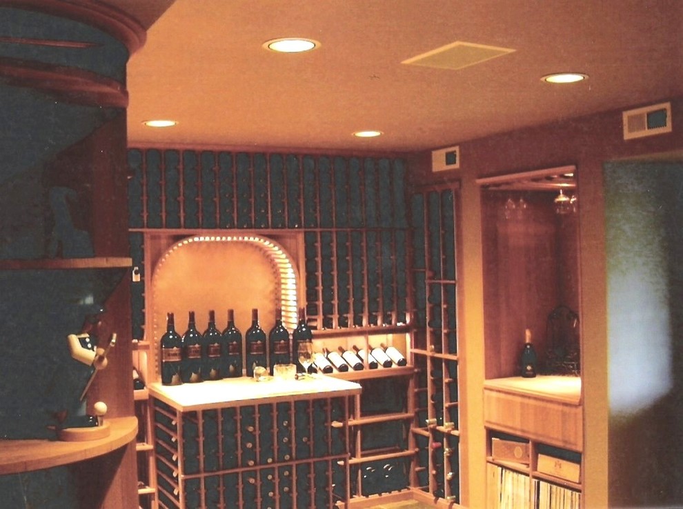 Expansive transitional wine cellar in Seattle with ceramic floors, display racks and multi-coloured floor.