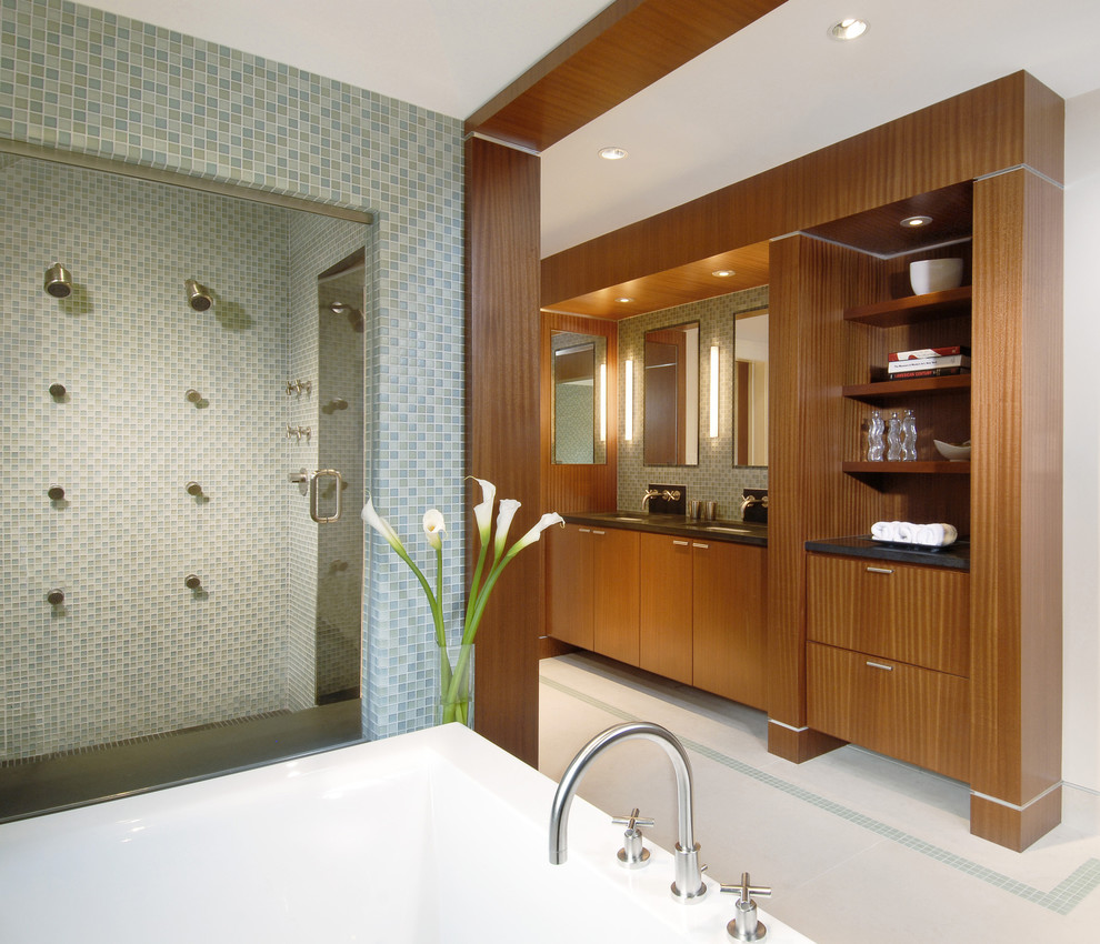 Design ideas for a large contemporary master bathroom in Boston with an undermount sink, flat-panel cabinets, medium wood cabinets, a double shower, mosaic tile, a drop-in tub, blue tile, white walls, mosaic tile floors, white floor and a hinged shower door.