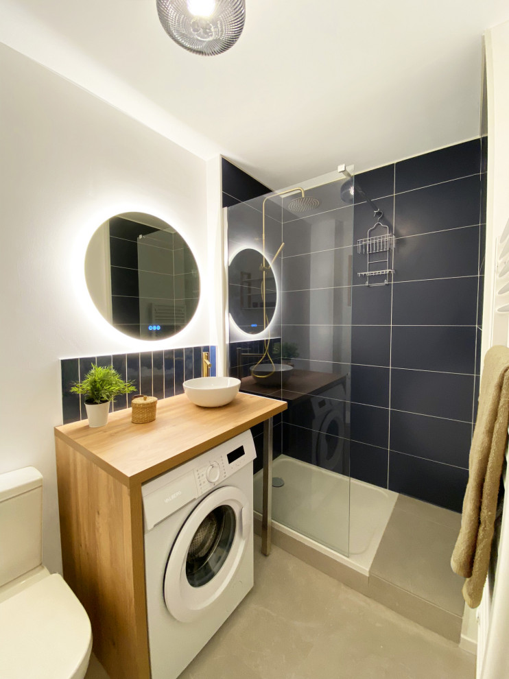 Small modern 3/4 bathroom in Lille with an open shower, a one-piece toilet, blue tile, ceramic tile, white walls, ceramic floors, a drop-in sink, laminate benchtops, beige floor, an open shower, brown benchtops and a single vanity.