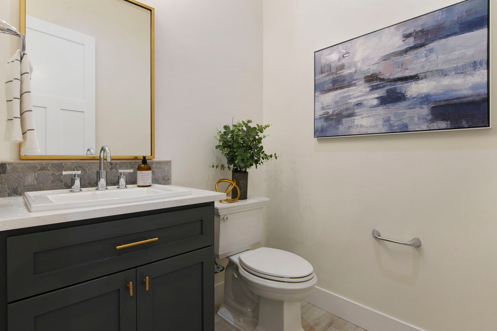 Design ideas for a small country bathroom in Sacramento with shaker cabinets, grey cabinets, a two-piece toilet, white walls, ceramic floors, an undermount sink, engineered quartz benchtops, white floor, white benchtops, a single vanity and a freestanding vanity.