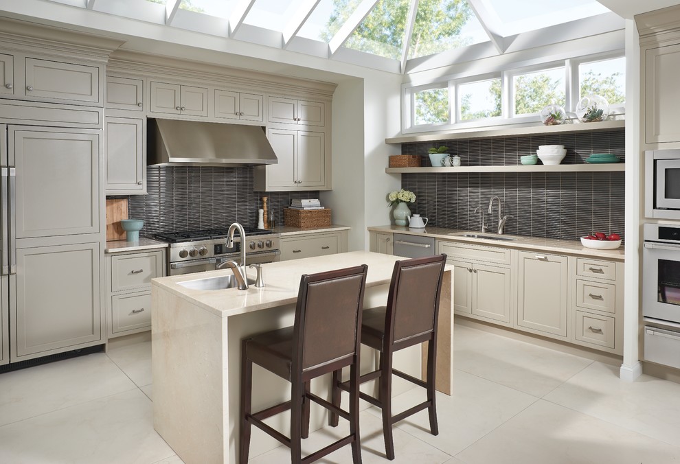 Eat-in kitchen - large transitional eat-in kitchen idea in Toronto with an undermount sink, beige cabinets, gray backsplash and an island