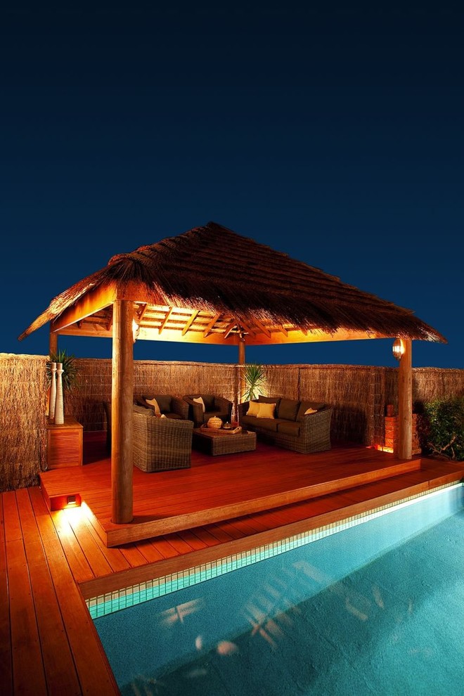 Design ideas for a tropical backyard deck in Perth.