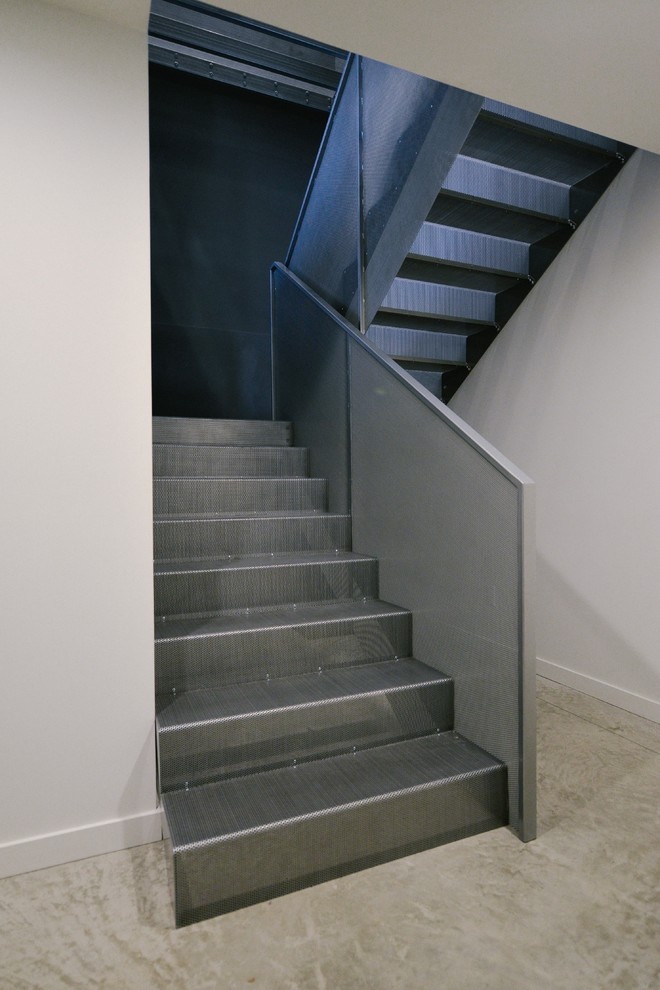 Inspiration for a mid-sized modern metal u-shaped staircase in Calgary with metal risers.