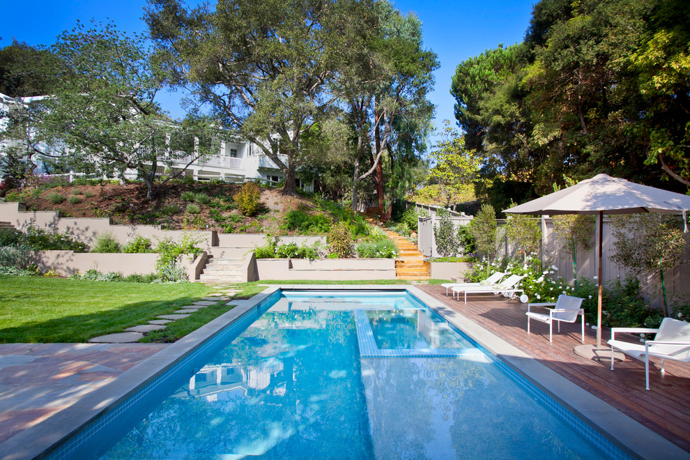 This is an example of a traditional pool in Los Angeles with decking.