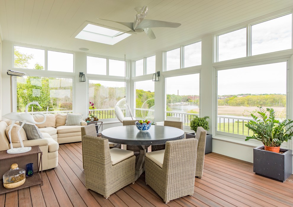 Inspiration for a traditional sunroom in Other with dark hardwood floors, a skylight and brown floor.
