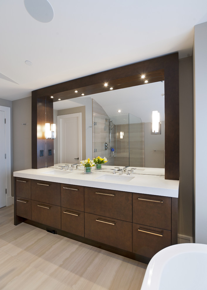 Design ideas for a transitional bathroom in Vancouver with an undermount sink, flat-panel cabinets, dark wood cabinets and beige tile.