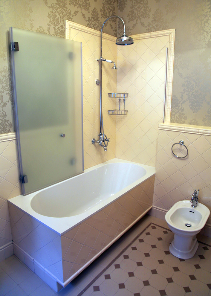 Mid-sized traditional master bathroom in Moscow with a pedestal sink, open cabinets, white cabinets, solid surface benchtops, a corner tub, a shower/bathtub combo, a two-piece toilet, beige tile, ceramic tile, beige walls and ceramic floors.