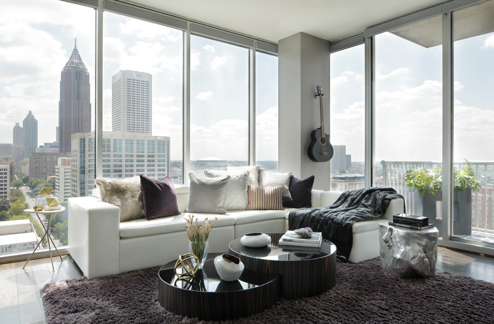 Contemporary formal living room in Atlanta with light hardwood floors.