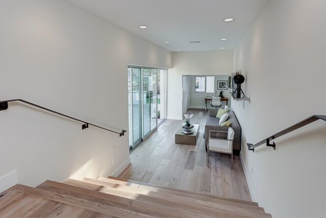 Photo of a mid-sized contemporary wood straight staircase in Los Angeles with wood risers.