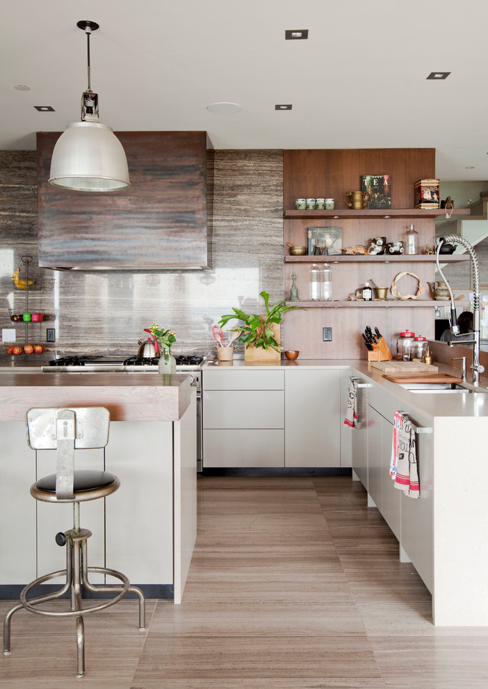 This is an example of a mid-sized contemporary l-shaped kitchen in Vancouver with a double-bowl sink, open cabinets, medium wood cabinets, stainless steel appliances, with island, stone slab splashback, porcelain floors and brown floor.