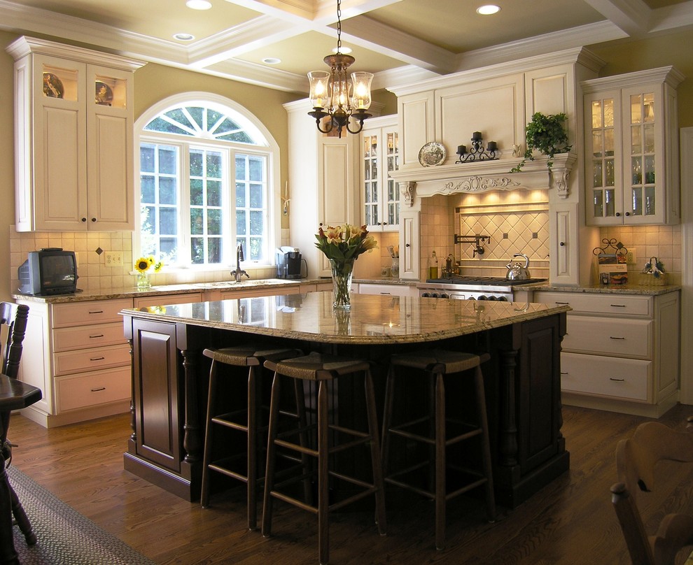 Photo of a contemporary kitchen in DC Metro with raised-panel cabinets and granite benchtops.