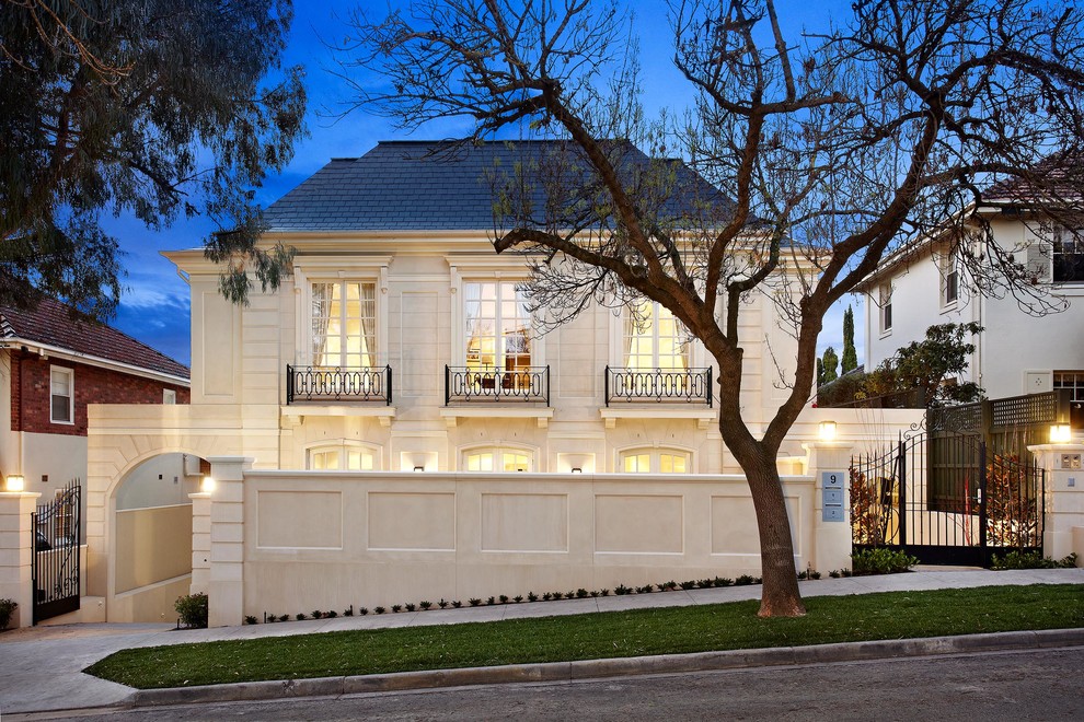 This is an example of a traditional two-storey white exterior in Melbourne with a hip roof.