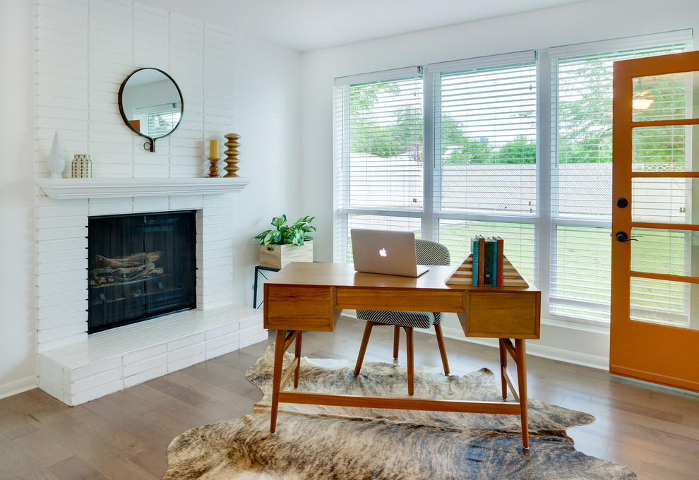 Inspiration for a mid-sized transitional study room in Phoenix with white walls, a standard fireplace, a brick fireplace surround and a freestanding desk.